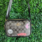 A BANDOLERA COACH NEGRA