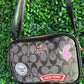 A BANDOLERA COACH NEGRA