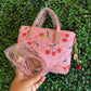 A BOLSA COACH ROSA CON LLAVERO CEREZAS