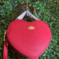 A BOLSA COACH CORAZON ROJO