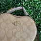 A BOLSA COACH CORAZON BEIGE