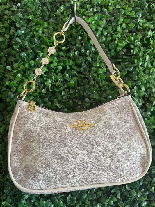 A BOLSA COACH GRIS BLANCO